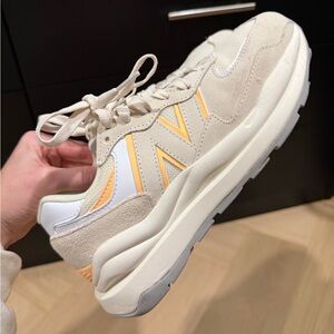 New Balance Beige and White Sneakers with Orange Accents